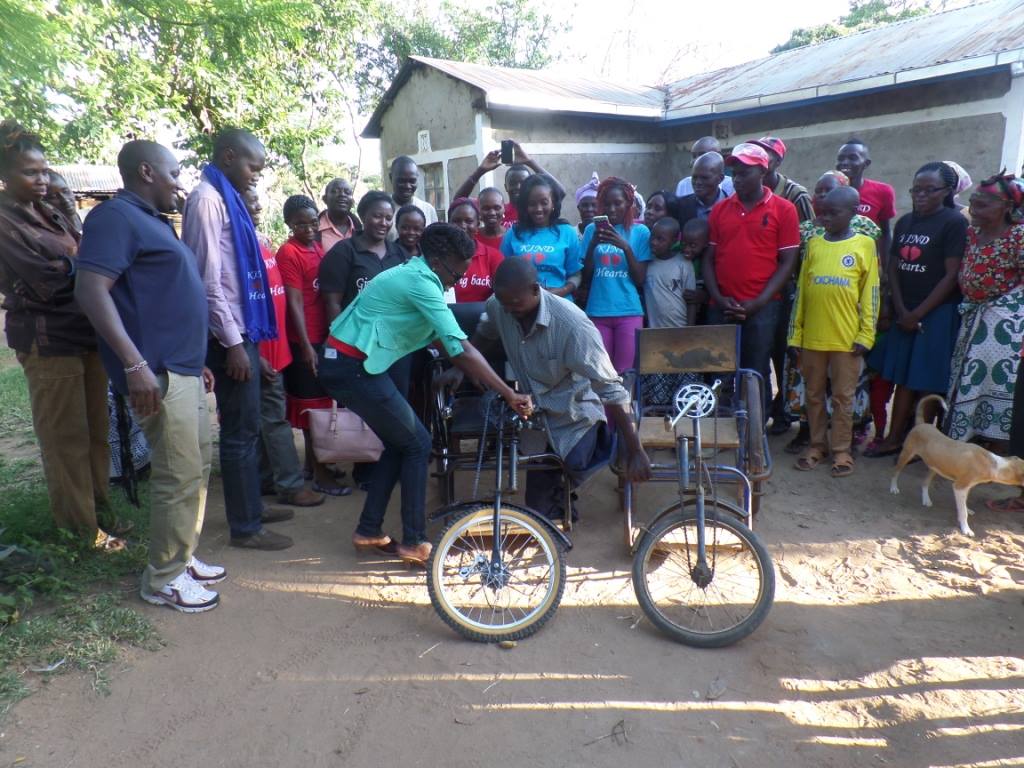 Handover event for wheelchair and water tank for Richard Makula